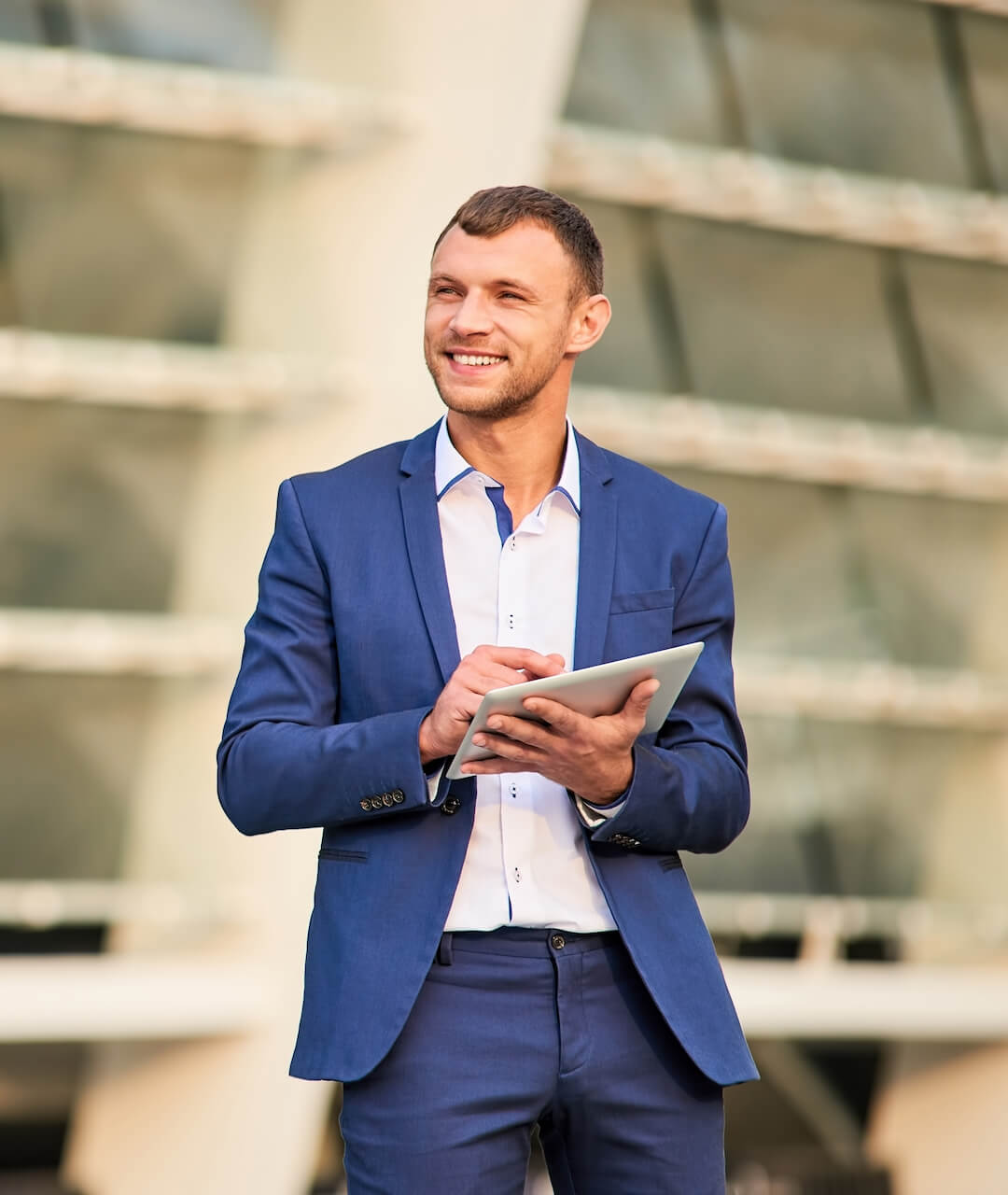 happy-businessman-with-a-tablet-2021-08-31-17-05-24-utc.jpg